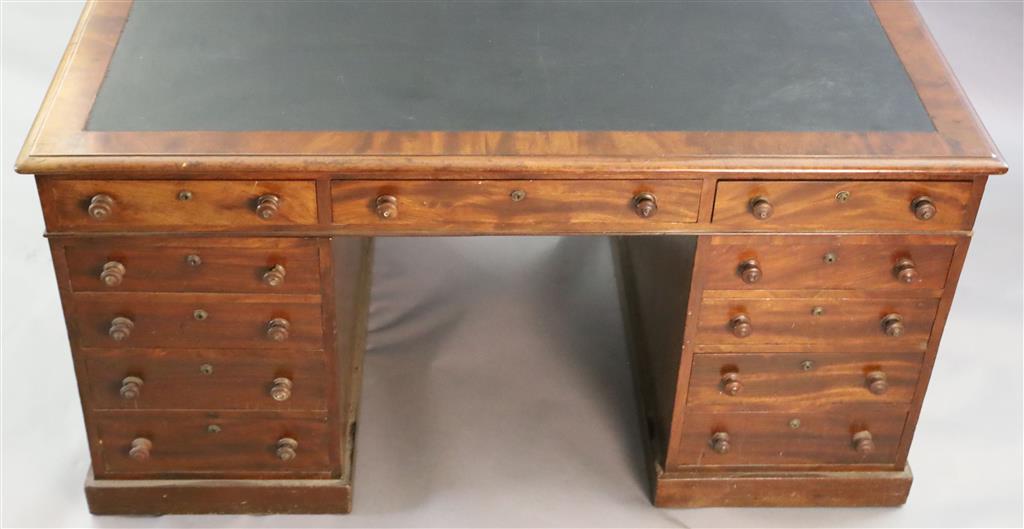 A Victorian mahogany twin pedestal partners desk, W.4ft 10in. D.3ft 4in. H.2ft 7in.